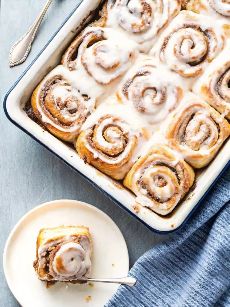 Soft cinnamon rolls made with Greek yogurt, swirled with cinnamon sugar and topped with vanilla glaze