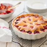 Freshly baked strawberry dessert cooling on a rack, perfect for summer strawberry cake recipes