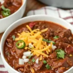 Bowl of authentic Texas chili recipe with beef, spices, and no beans.