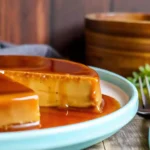 Delicious Dulce De Leche Flan dessert topped with caramel and chocolate shavings.