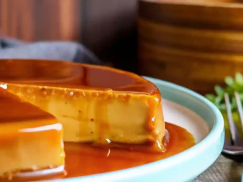 Delicious Dulce De Leche Flan dessert topped with caramel and chocolate shavings.