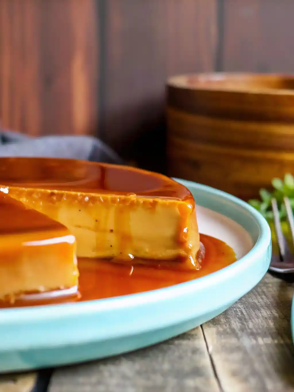 Delicious Dulce De Leche Flan dessert topped with caramel and chocolate shavings.