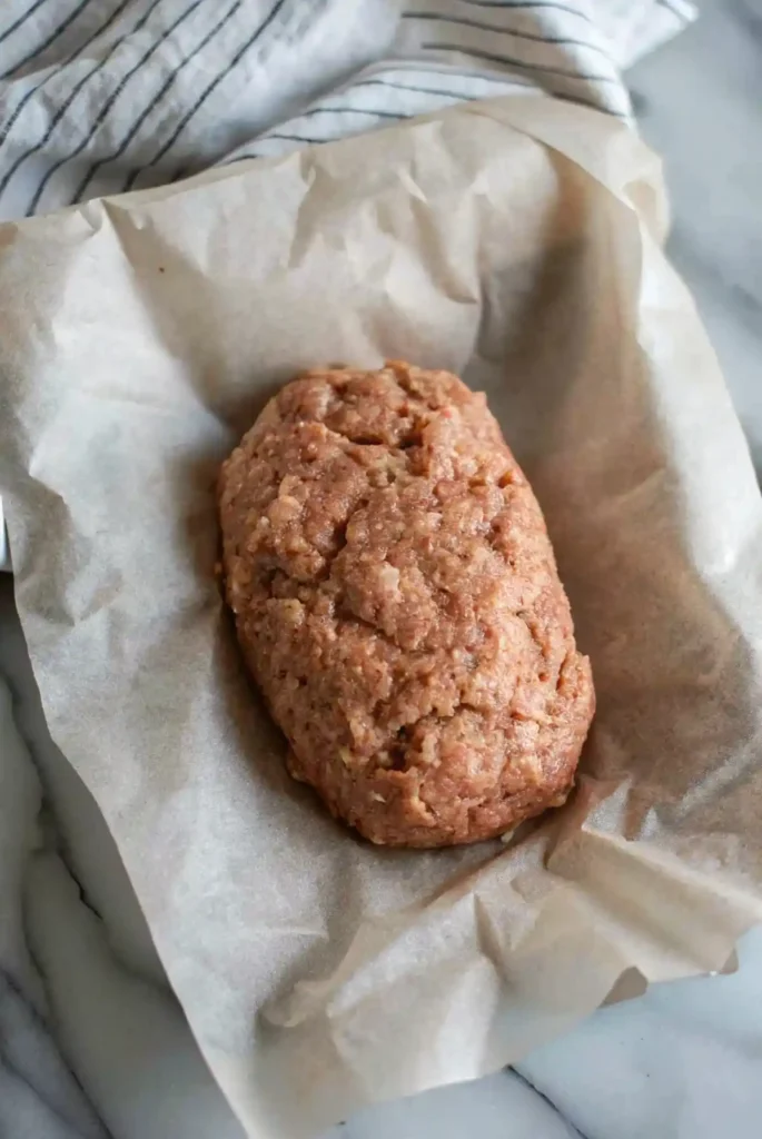 formed lipton's onion soup meatloaf recipe in pan, ready for baking.