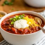 Bowl of hearty vegan chili loaded with beans and vegetables