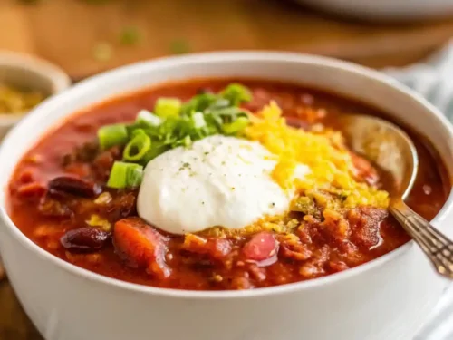 Bowl of hearty vegan chili loaded with beans and vegetables