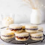 Classic Argentine Alfajores filled with dulce de leche and rolled in coconut.