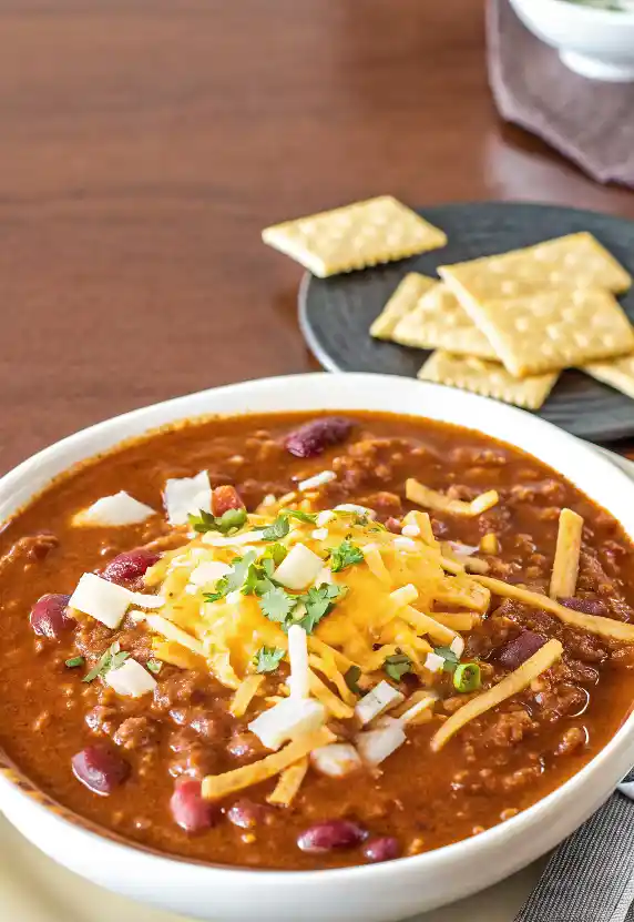 Delicious quick and easy chili recipe in a bowl with toppings.