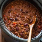 Delicious chili crock pot recipe with ground beef and beans in a slow cooker.