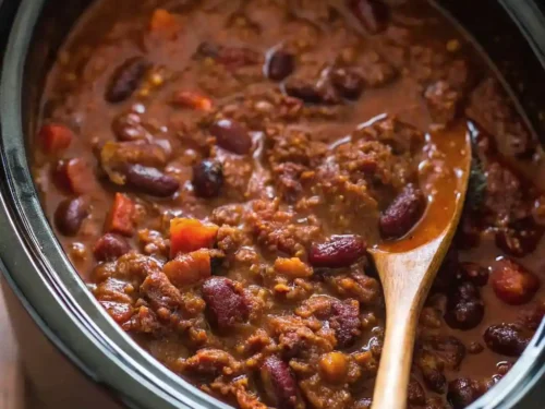 Delicious chili crock pot recipe with ground beef and beans in a slow cooker.