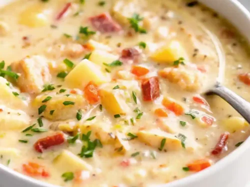 Creamy chicken and potato soup with tender potatoes and juicy chicken in a bowl.